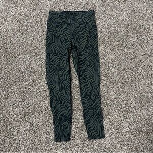 Sweaty Betty Zero Gravity High-Waisted 7/8 Leggings in a green zebra print
